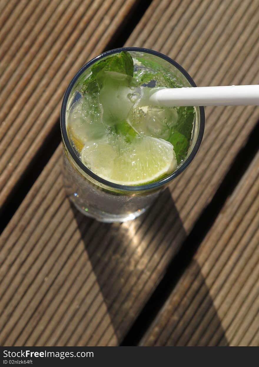 Fresh summer at the beach table cocktail contain ice and mint. Fresh summer at the beach table cocktail contain ice and mint