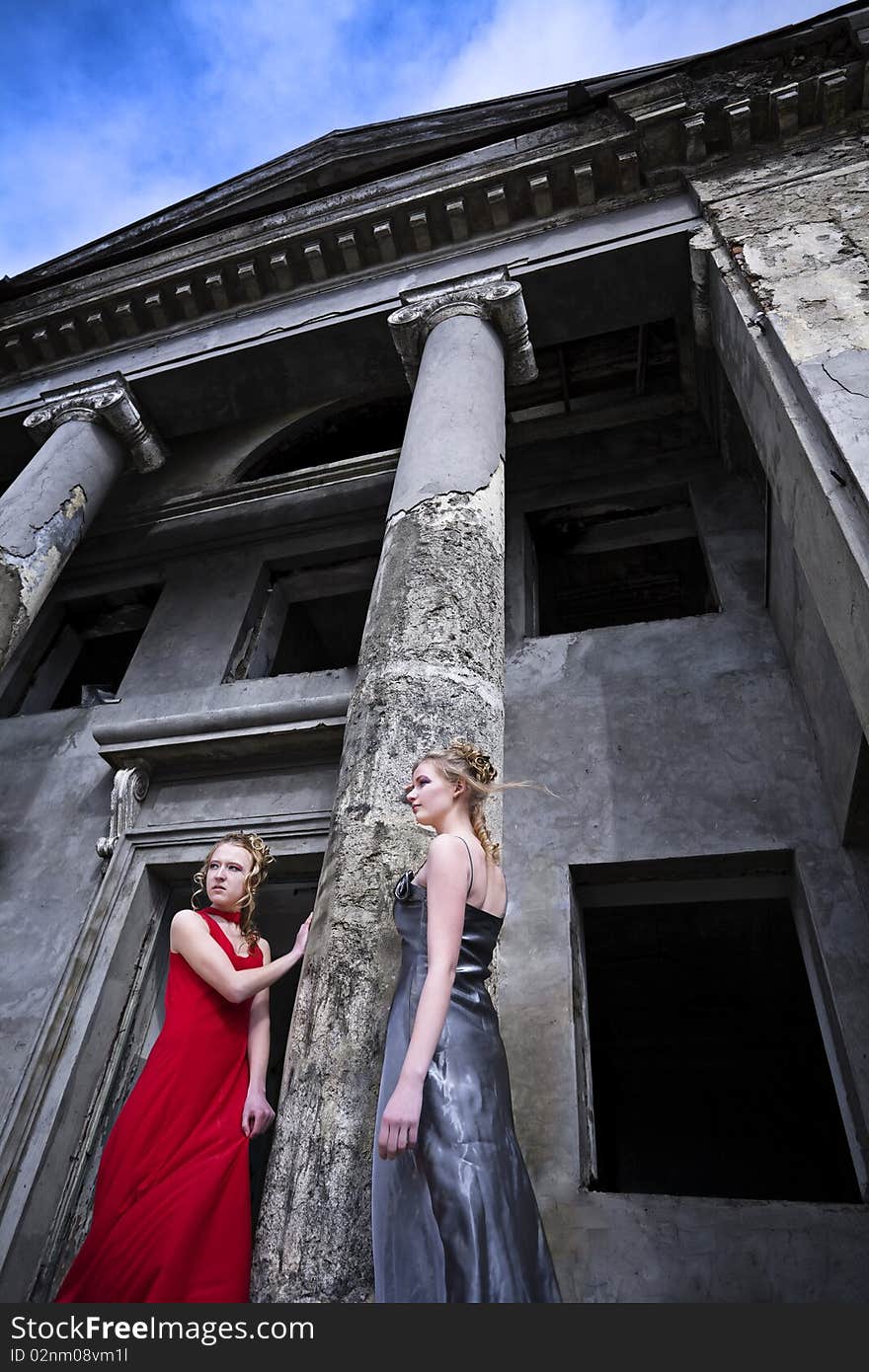 Waiting for the storm to come two girls near column. Waiting for the storm to come two girls near column