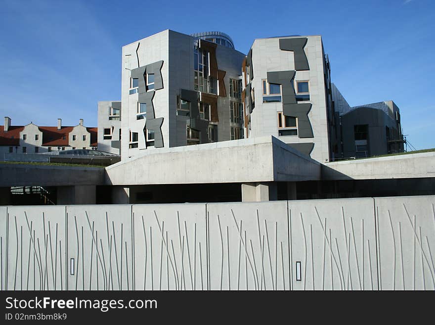 A beautiful and unusual perspective. This is the Scottish Parliament, Royal Mile, Holyrood, Edinburgh. One Side of the building on the high street. Beautiful wall, concrete. Looking from behind parliament with Arthur's Seat at my back and the building between me and the Royal Mile. A beautiful and unusual perspective. This is the Scottish Parliament, Royal Mile, Holyrood, Edinburgh. One Side of the building on the high street. Beautiful wall, concrete. Looking from behind parliament with Arthur's Seat at my back and the building between me and the Royal Mile