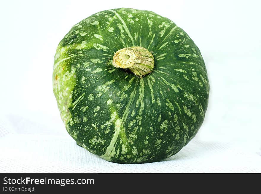 Still life, a pumpkin on the white background