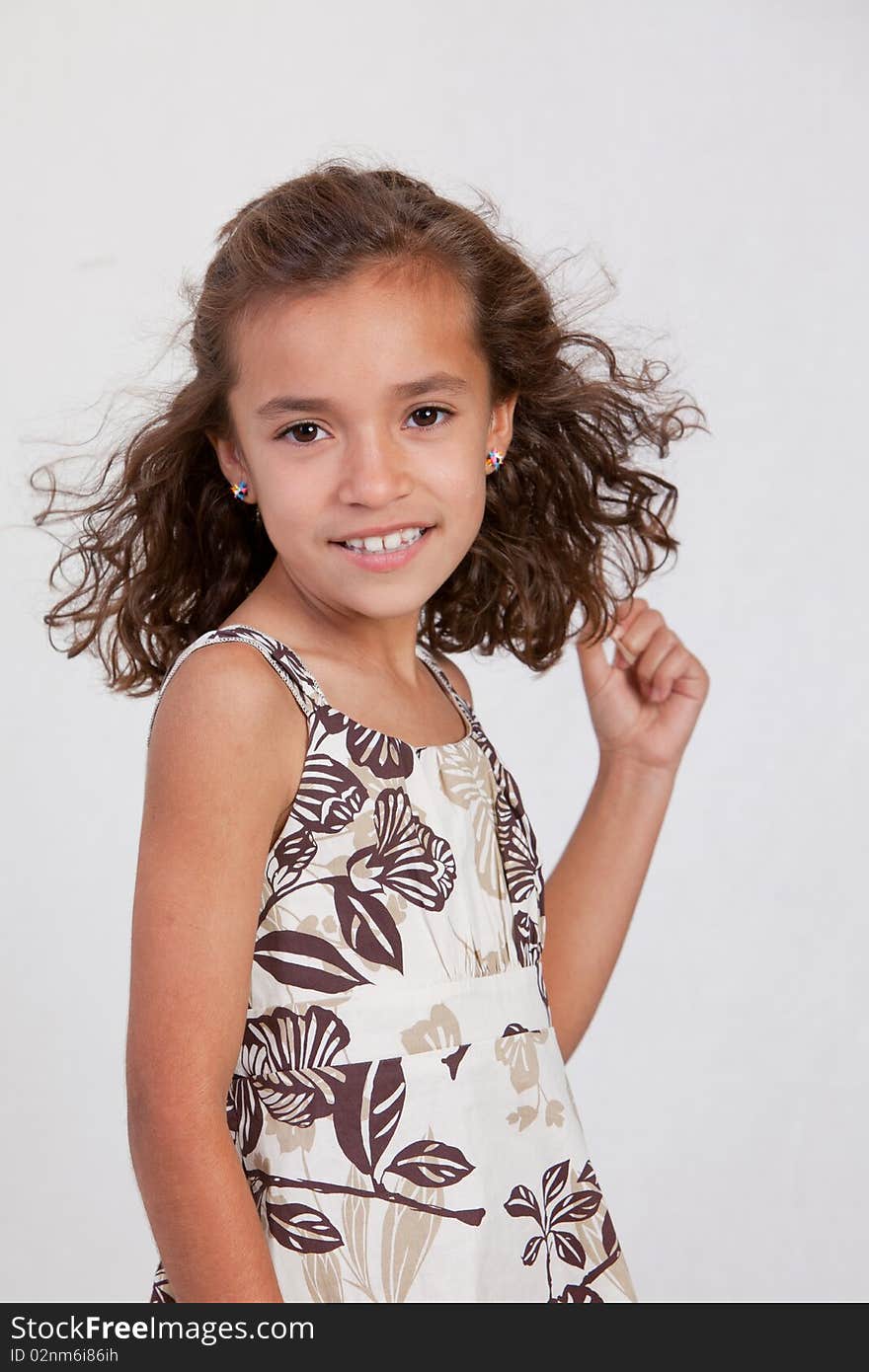 Cute Latina Girl smiling with brown dress