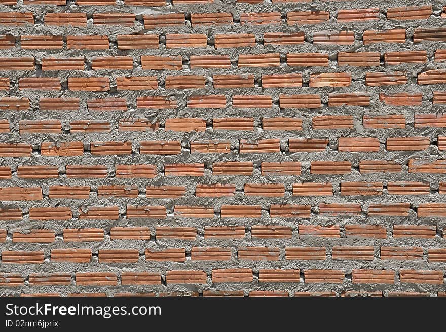 Brown color brick wall in the similar pattern. Brown color brick wall in the similar pattern