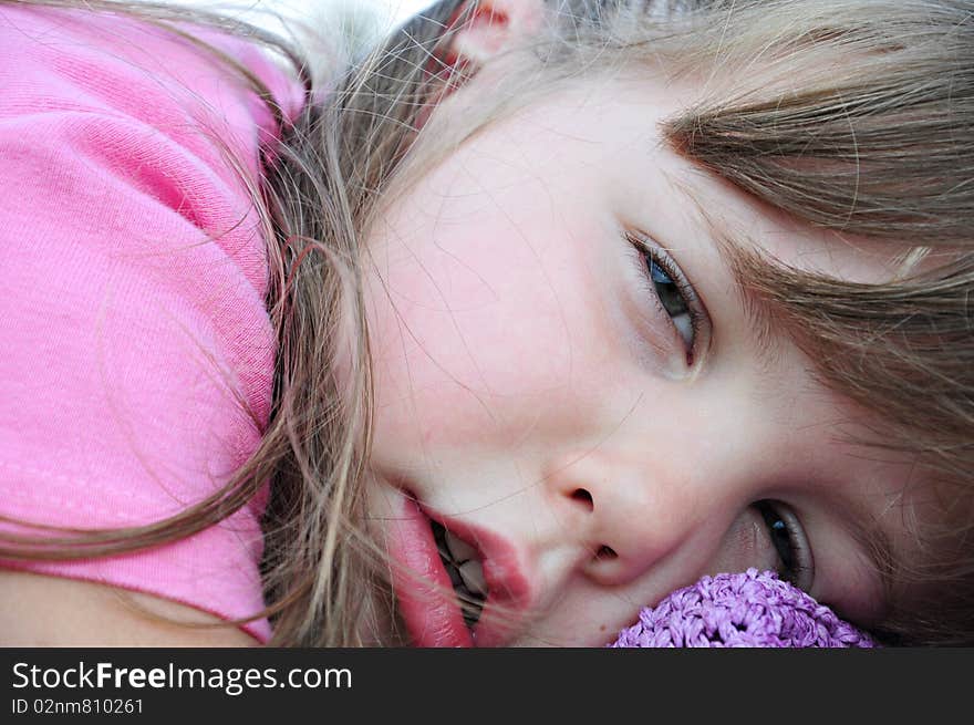 Girl sleeping on a bench in the nature of