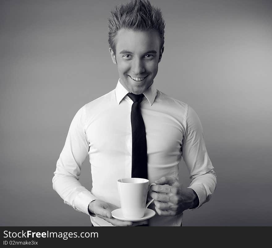 Young attractive macho drinking coffe. photo