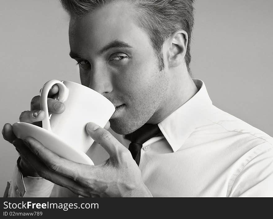 Young Attractive Macho Drinking Coffe