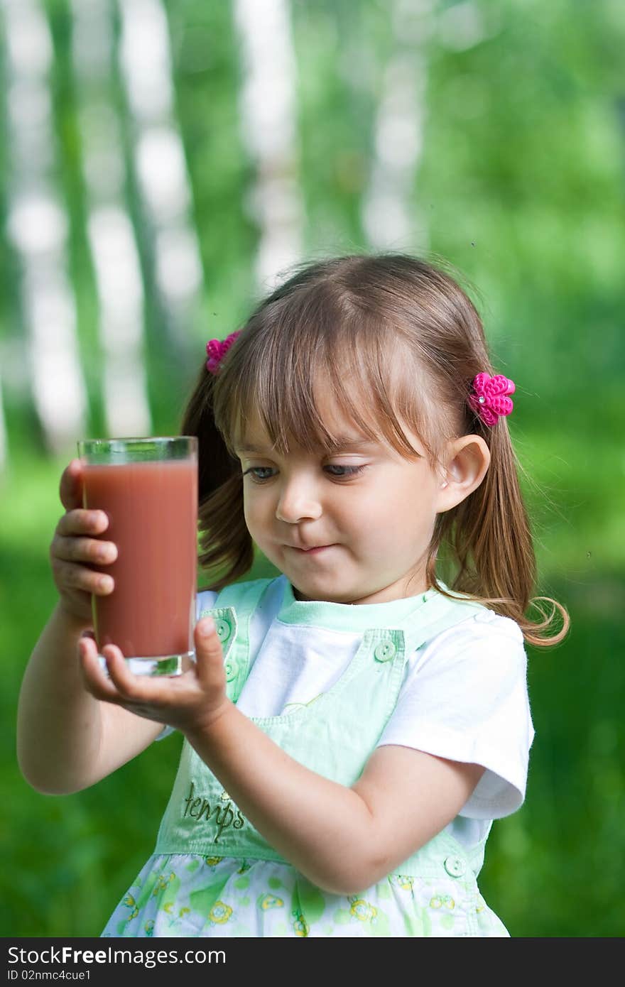 Little Girl Portrait With Glass Plum Juice