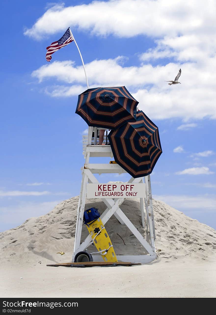 A lifeguard stand near the shoreline on the Eastern Seaboard, USA. A lifeguard stand near the shoreline on the Eastern Seaboard, USA