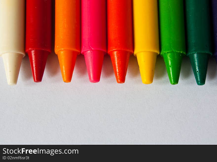 Colorful Crayons on white background.