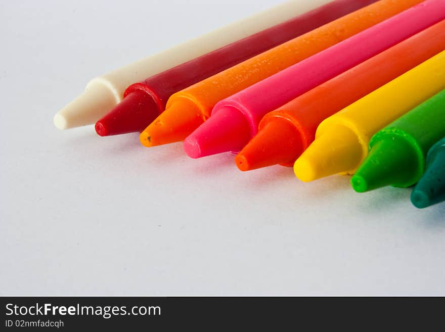 Colorful Crayons on white background.