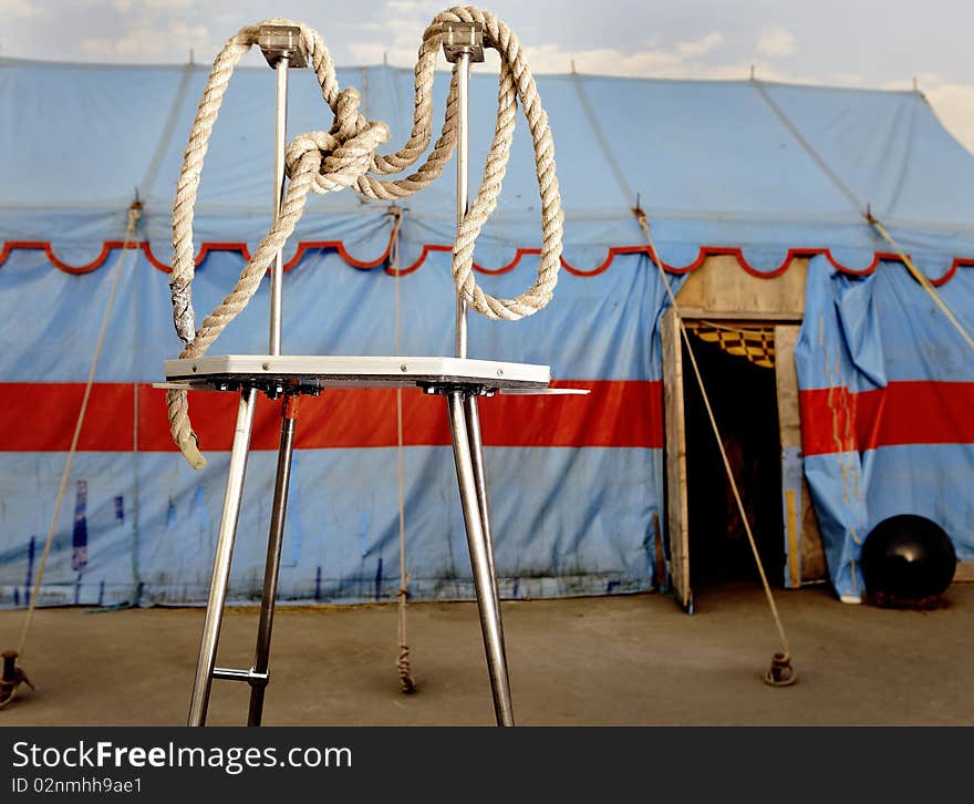 Circus symbolism. A wattled rope on a metal stage