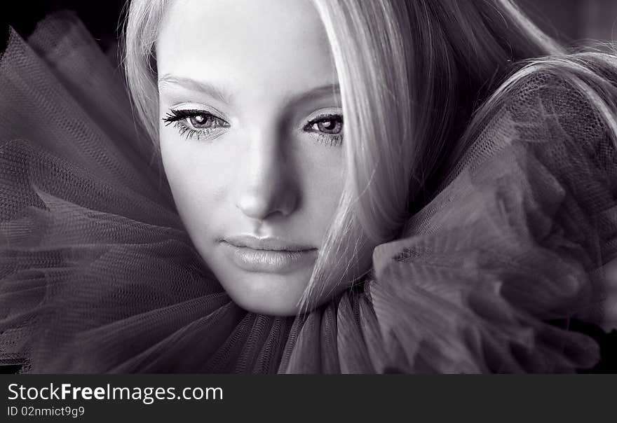 Attractive Blond Beauty In A Theatrical Jabot.