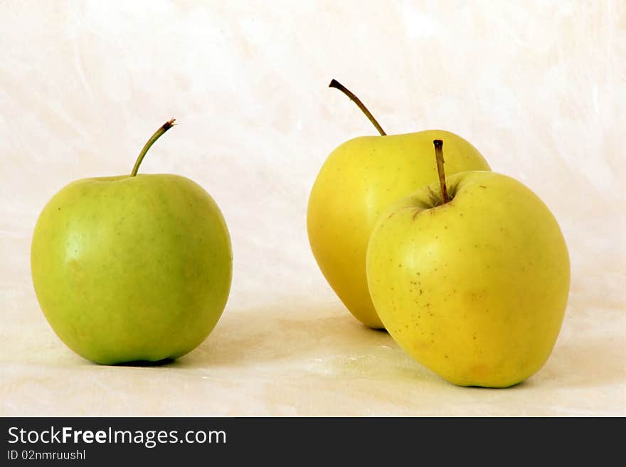 Three yellow apples