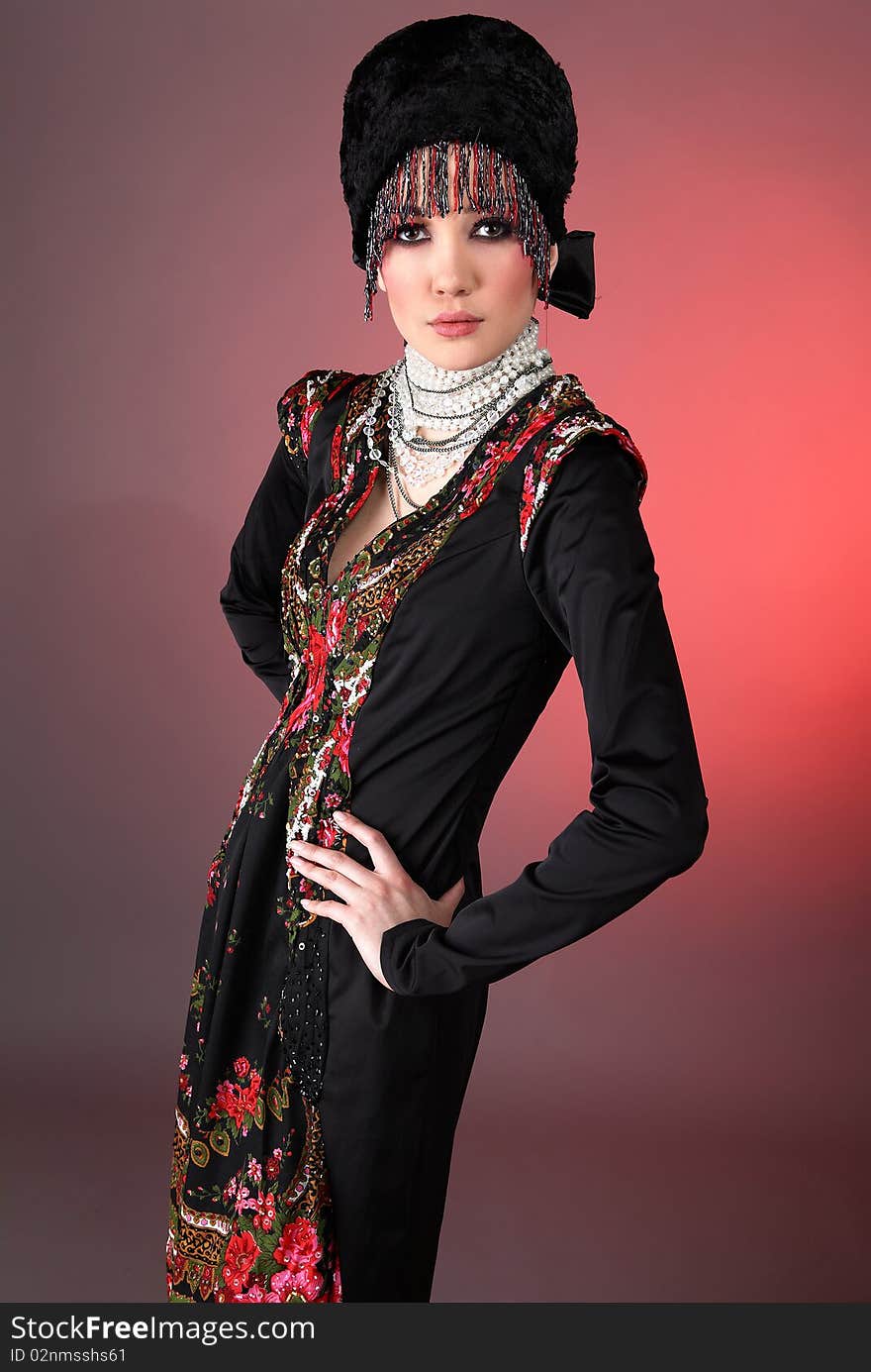 Attractive model in exclusive design clothes on manners old-slavic. Photo.