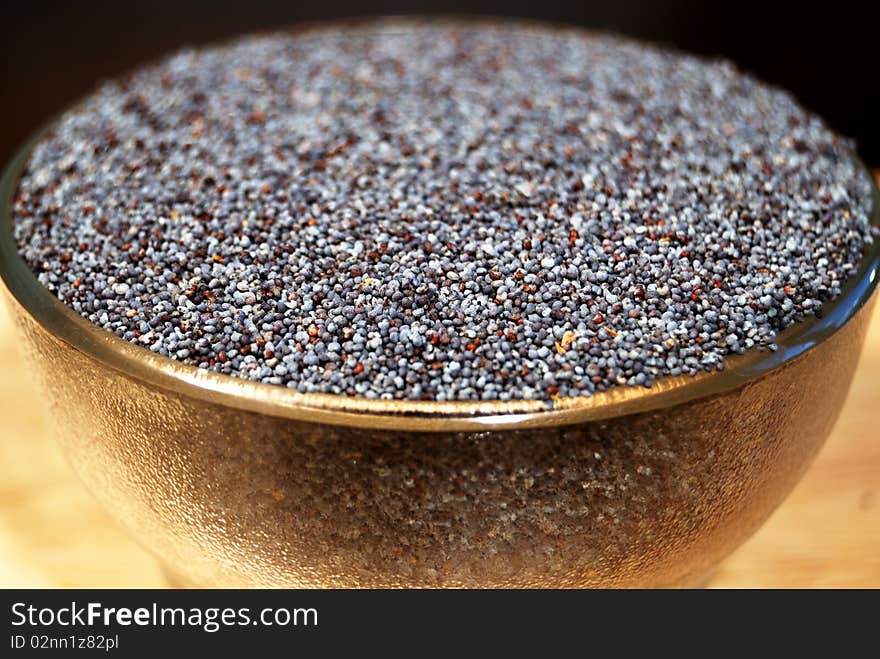 Poppy seeds in a glass tea-bowl