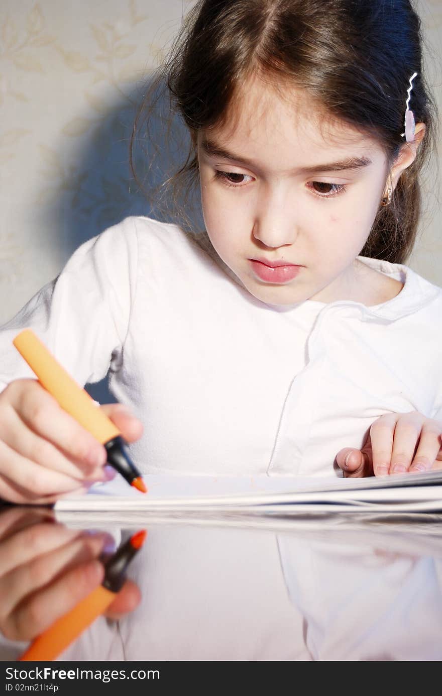 Young School Girl Drawing  At Home