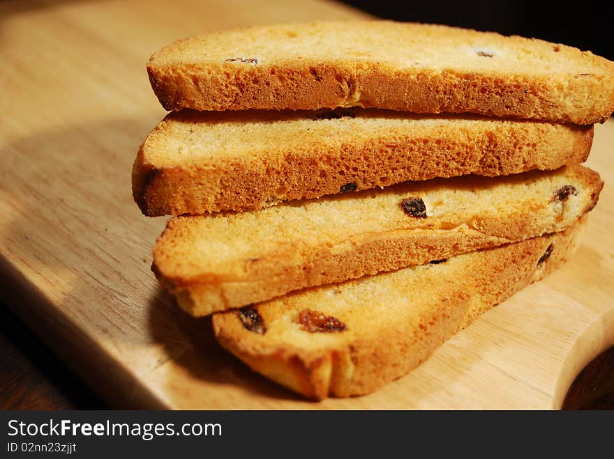 Dry bread slices wheat on wooden desk. Dry bread slices wheat on wooden desk