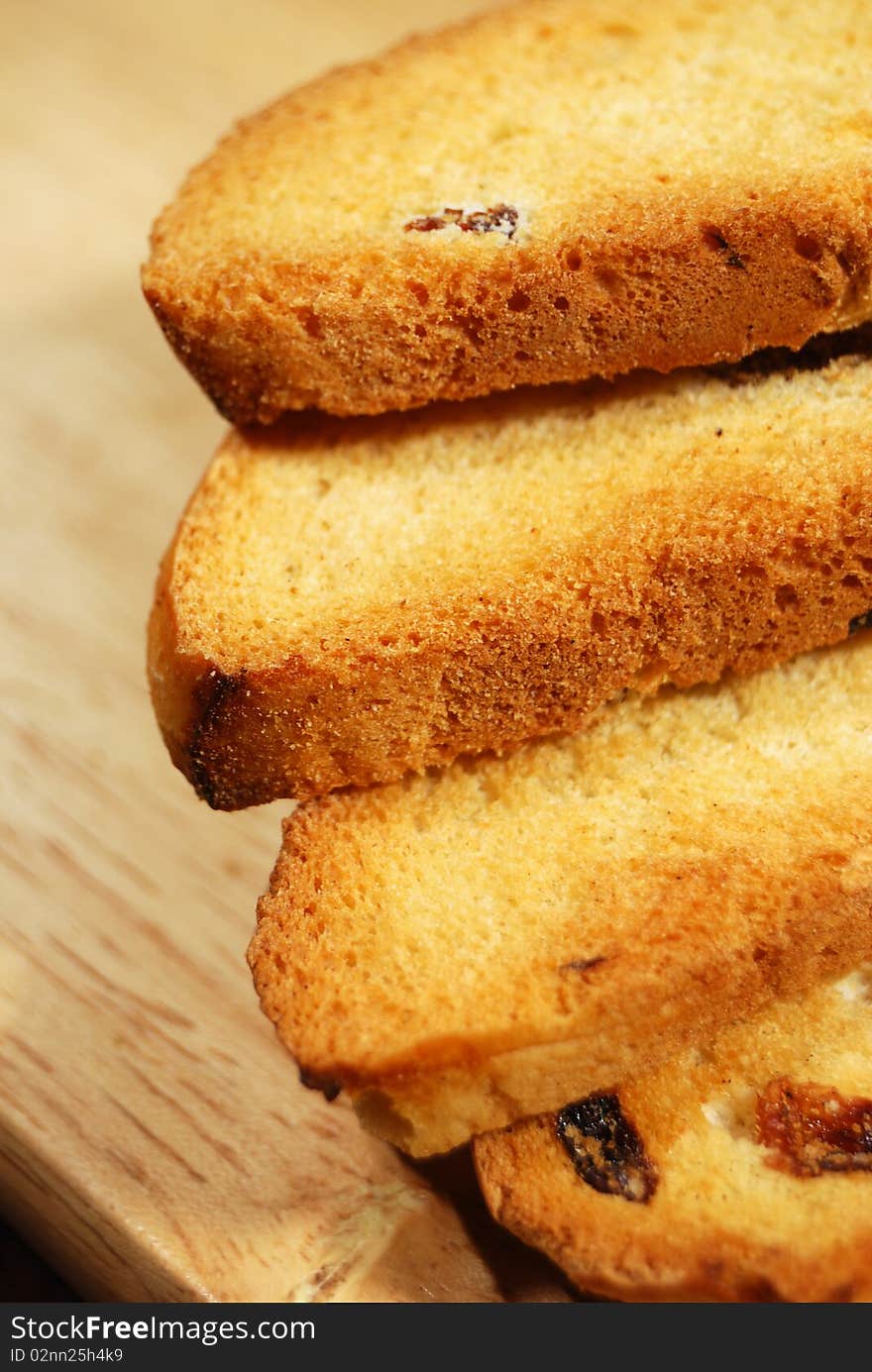 Dry bread slices wheat on wooden desk. Dry bread slices wheat on wooden desk