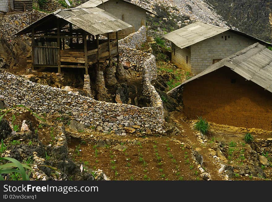 In the karst of Ha Giang in Vietnam's northern stones abound. Here a barn erected on piles of stones. The closure of the farm was hard work for all these piled stones. In the karst of Ha Giang in Vietnam's northern stones abound. Here a barn erected on piles of stones. The closure of the farm was hard work for all these piled stones.