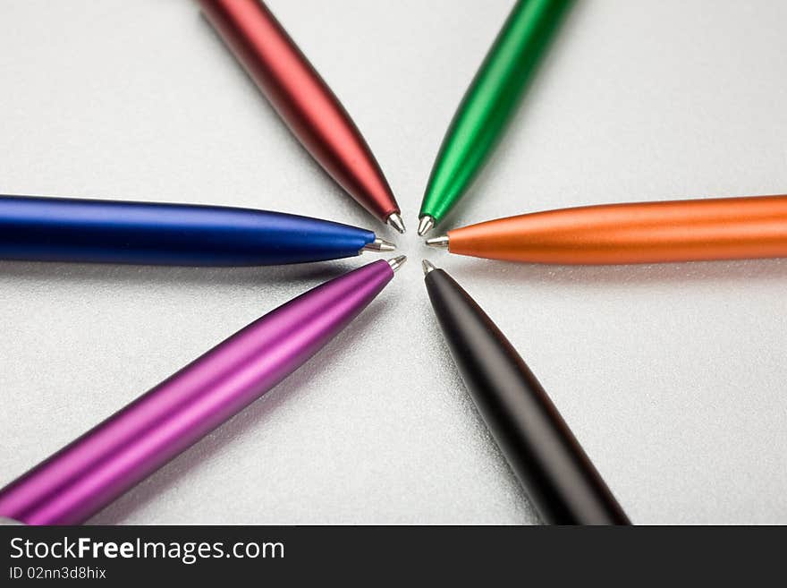 Set of colored pens on grey table. Set of colored pens on grey table