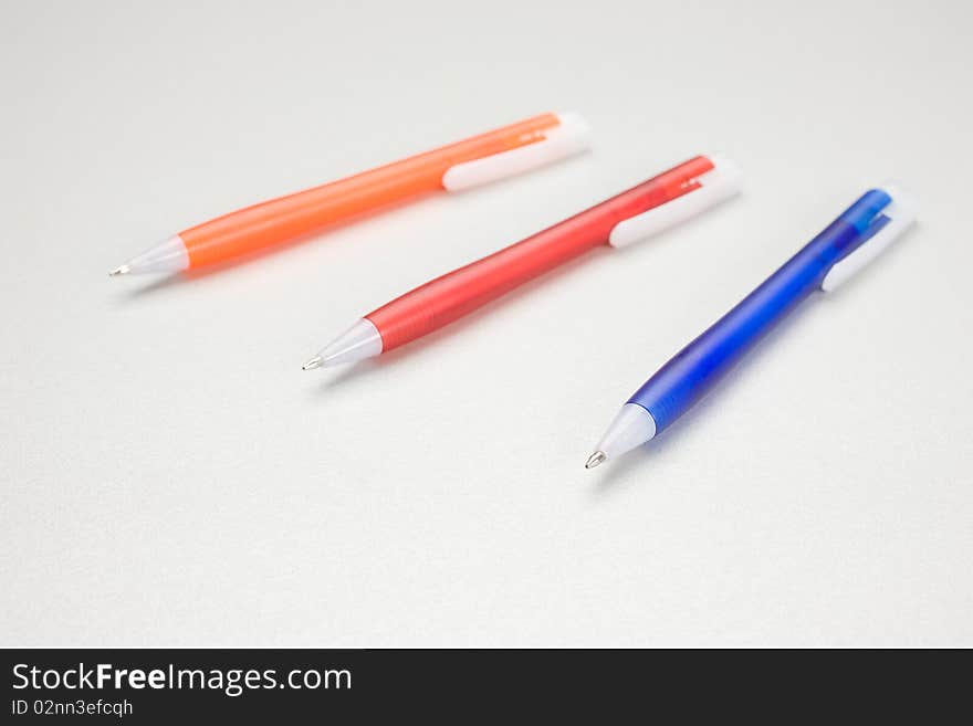 Set of colored pens on table