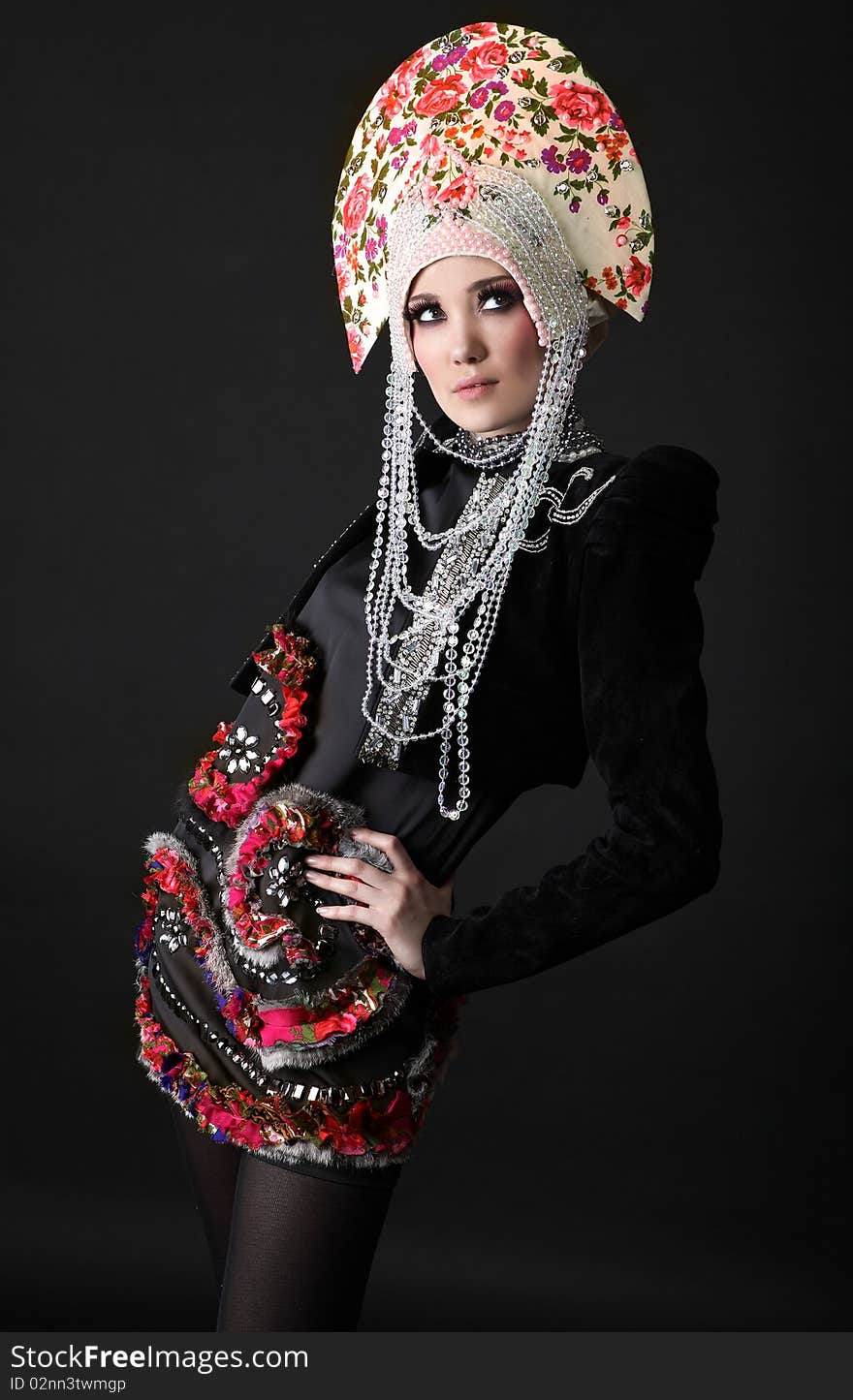 Attractive model in exclusive design clothes on manners old-slavic. Photo.