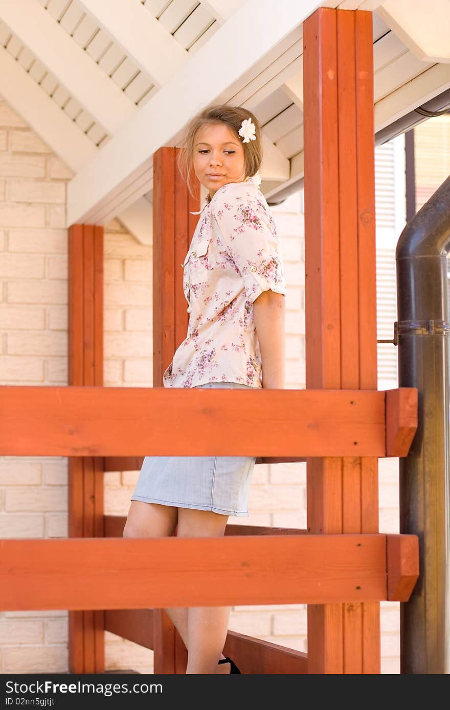 Girl on a veranda