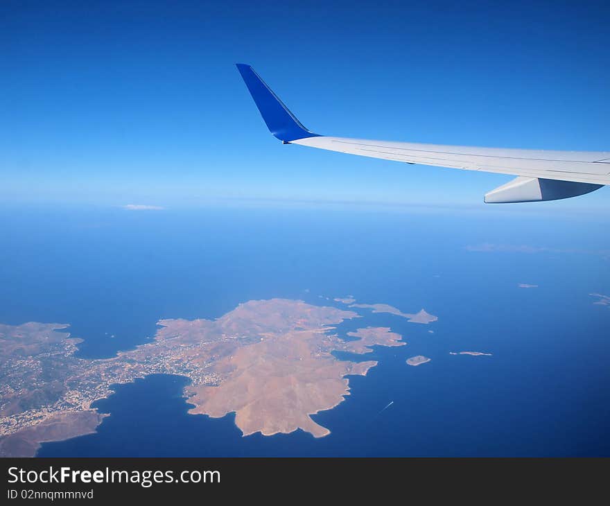 Airplane flying above greek islands. Airplane flying above greek islands