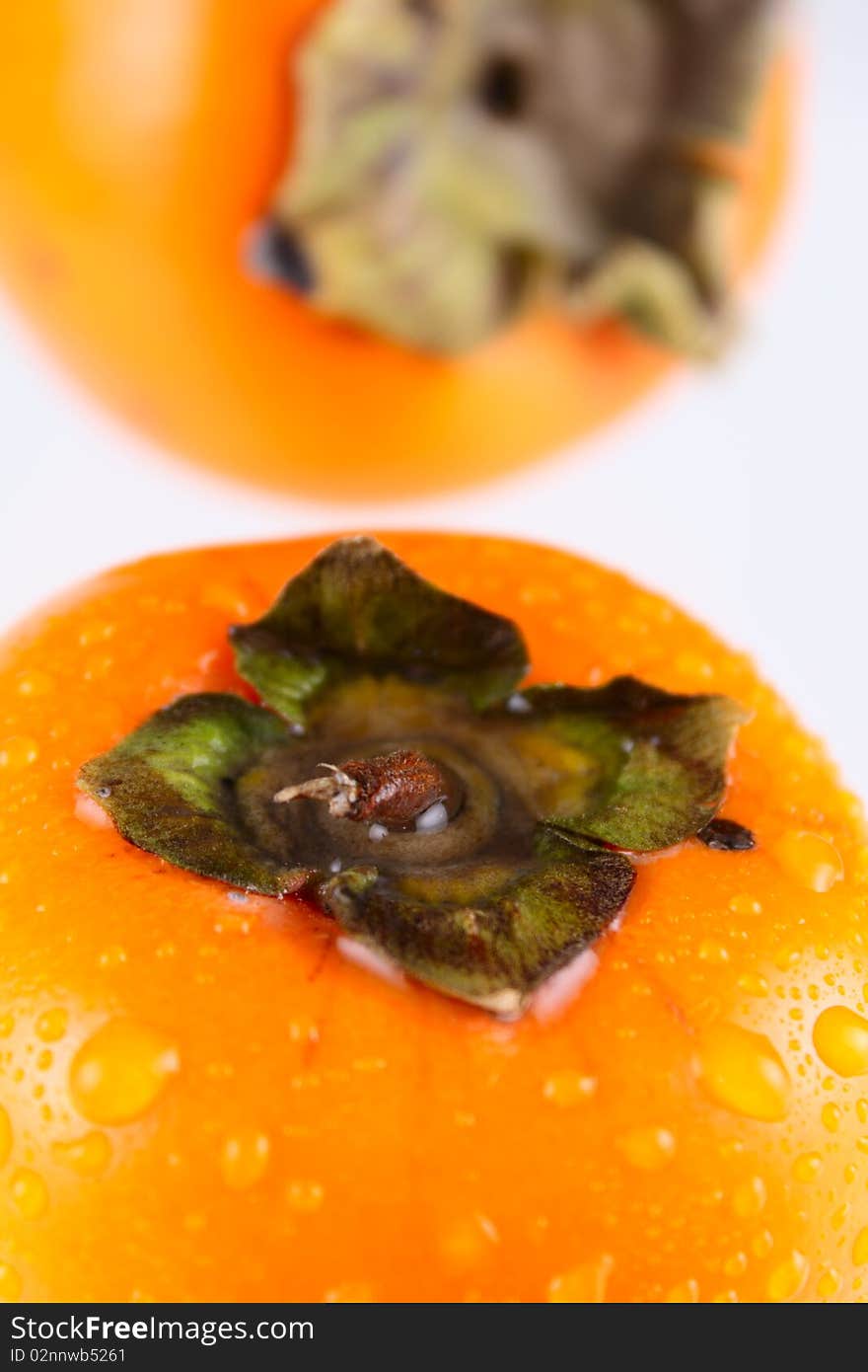 Persimmon removed close up on white background without isolation. Persimmon removed close up on white background without isolation