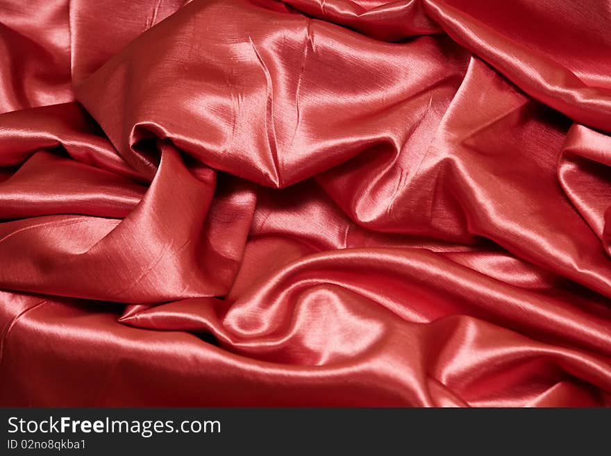 A red satin background or texture