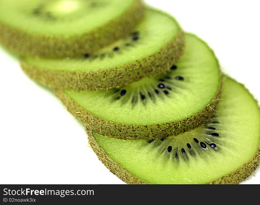 Kiwi slices overlapping on a white background. Kiwi slices overlapping on a white background