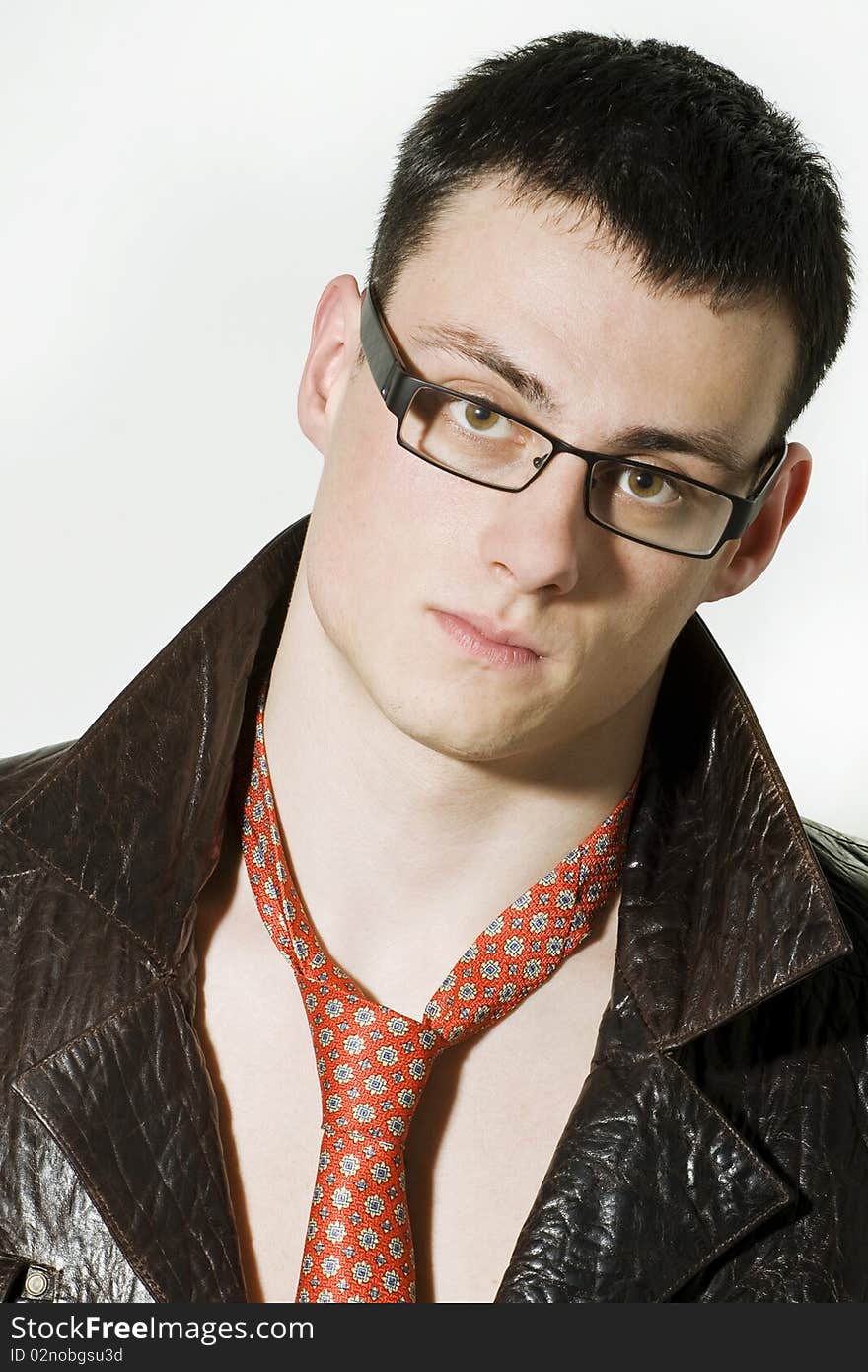 Portrait of young man in a leather jacket and glasses. Portrait of young man in a leather jacket and glasses