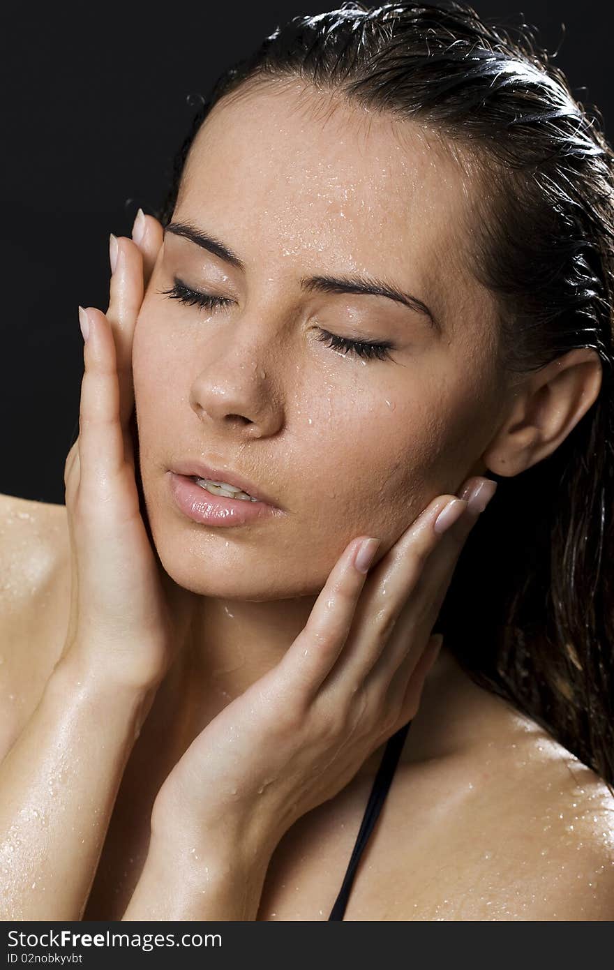 Portrait of the brunette in drop of water on black background. Portrait of the brunette in drop of water on black background