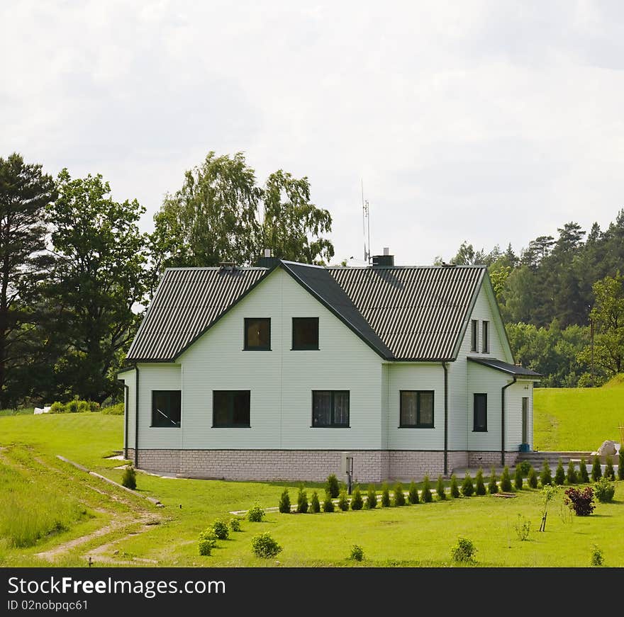 House, lawn, blue sky