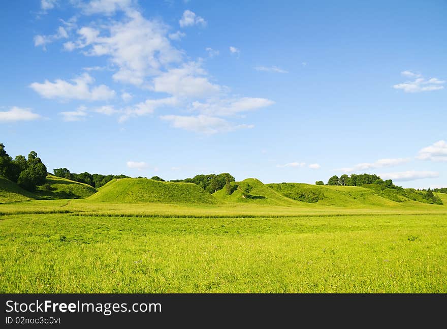 Green hill blue sky