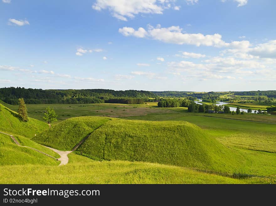 Green hill blue sky