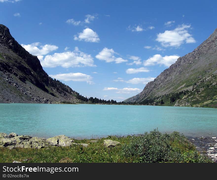 Sky, mountains and blue lake. Sky, mountains and blue lake.