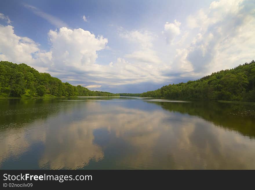 Summer lake, green coast, blue sky