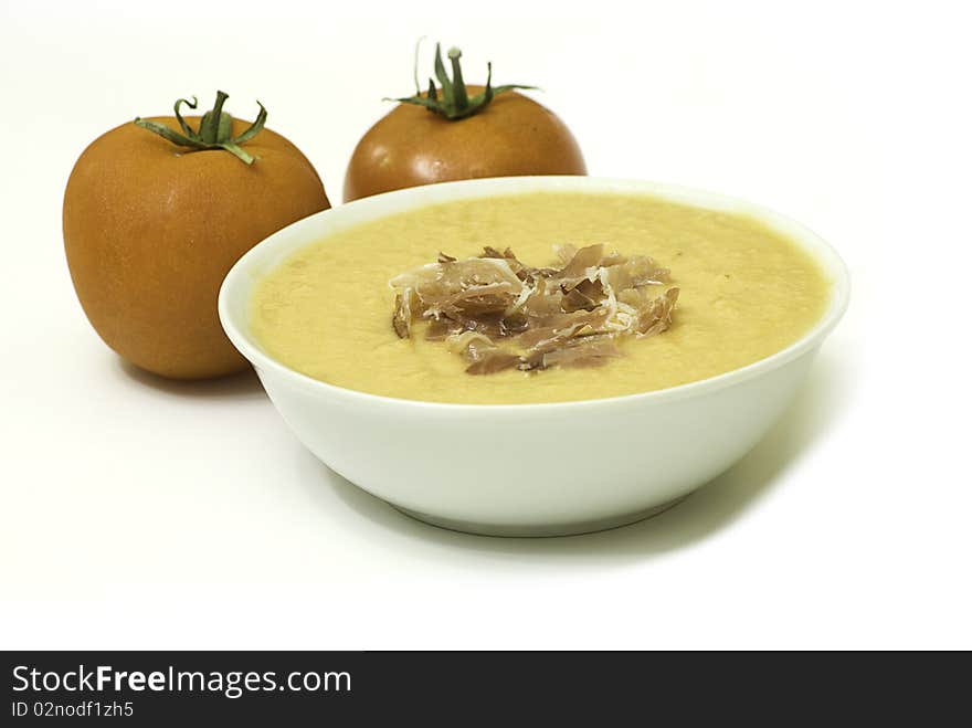 Salmorejo presentation with two tomatoes on white background. Salmorejo presentation with two tomatoes on white background