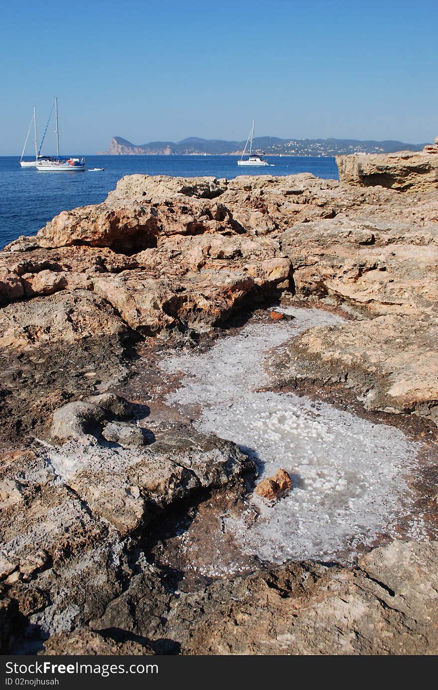 Hole with sea salt on top. The horizon in the background.