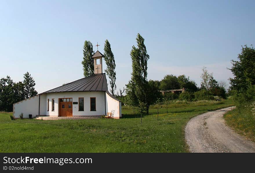 A little contemporary church beside macadam road, Banija County, Croatia. A little contemporary church beside macadam road, Banija County, Croatia