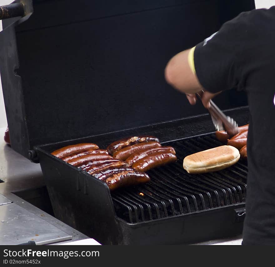 Shot of hot dogs in a grill