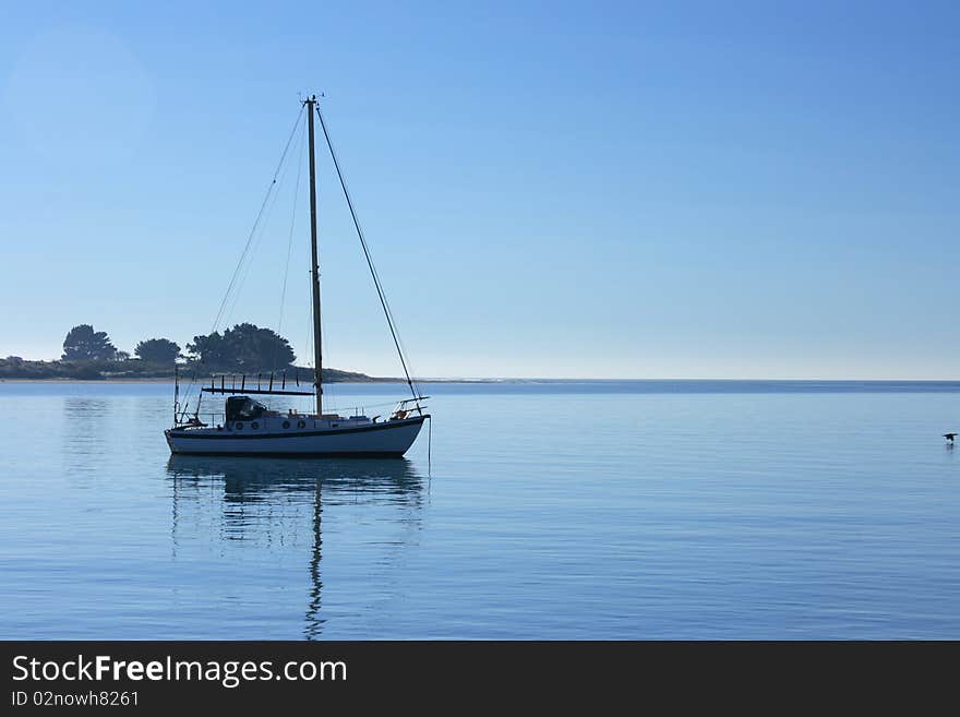 A Yacht at anchor in Sumner harbour, New Zealand. A Yacht at anchor in Sumner harbour, New Zealand.