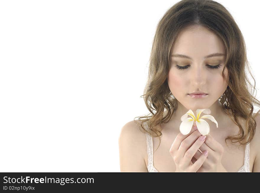 Young woman holding frangipani on white. Young woman holding frangipani on white