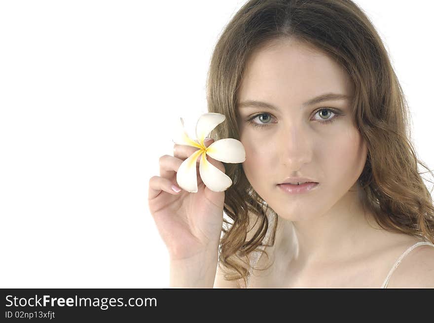 Young woman holding frangipani on white. Young woman holding frangipani on white