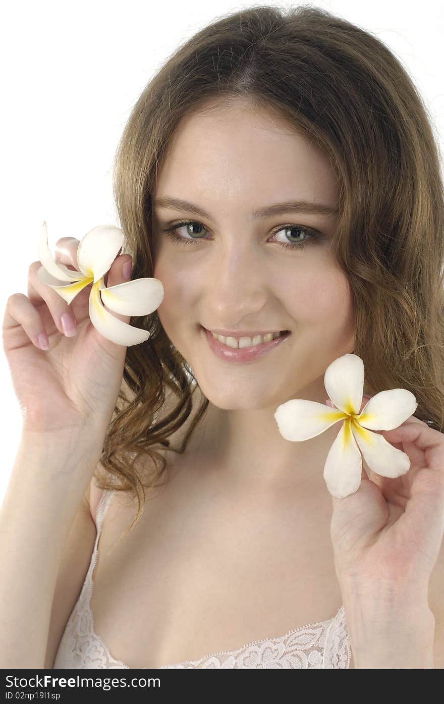 Young woman holding frangipani on white. Young woman holding frangipani on white