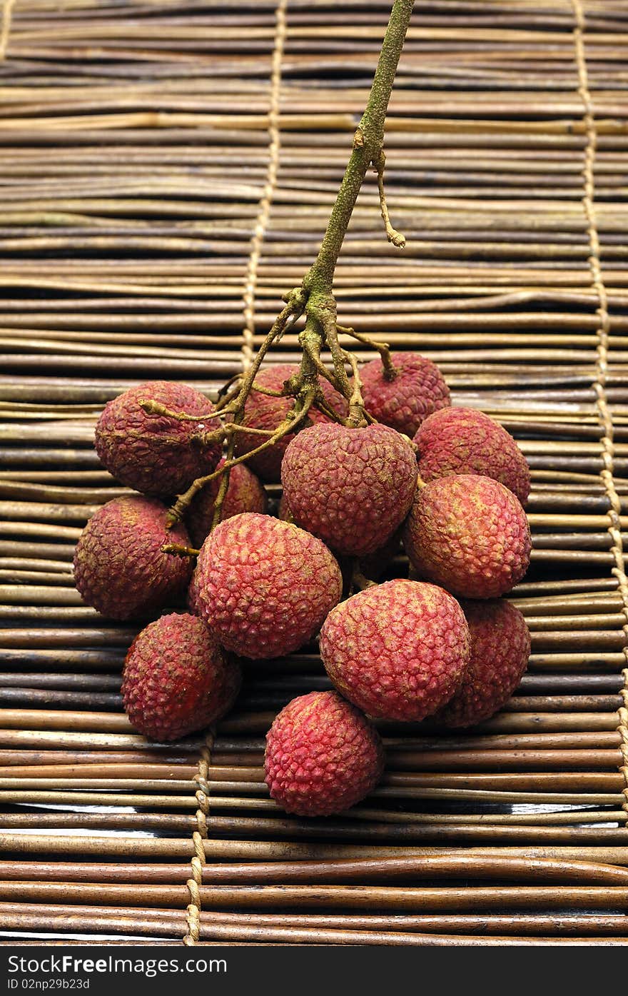 Lychee fruit on bamboo mat. Lychee fruit on bamboo mat