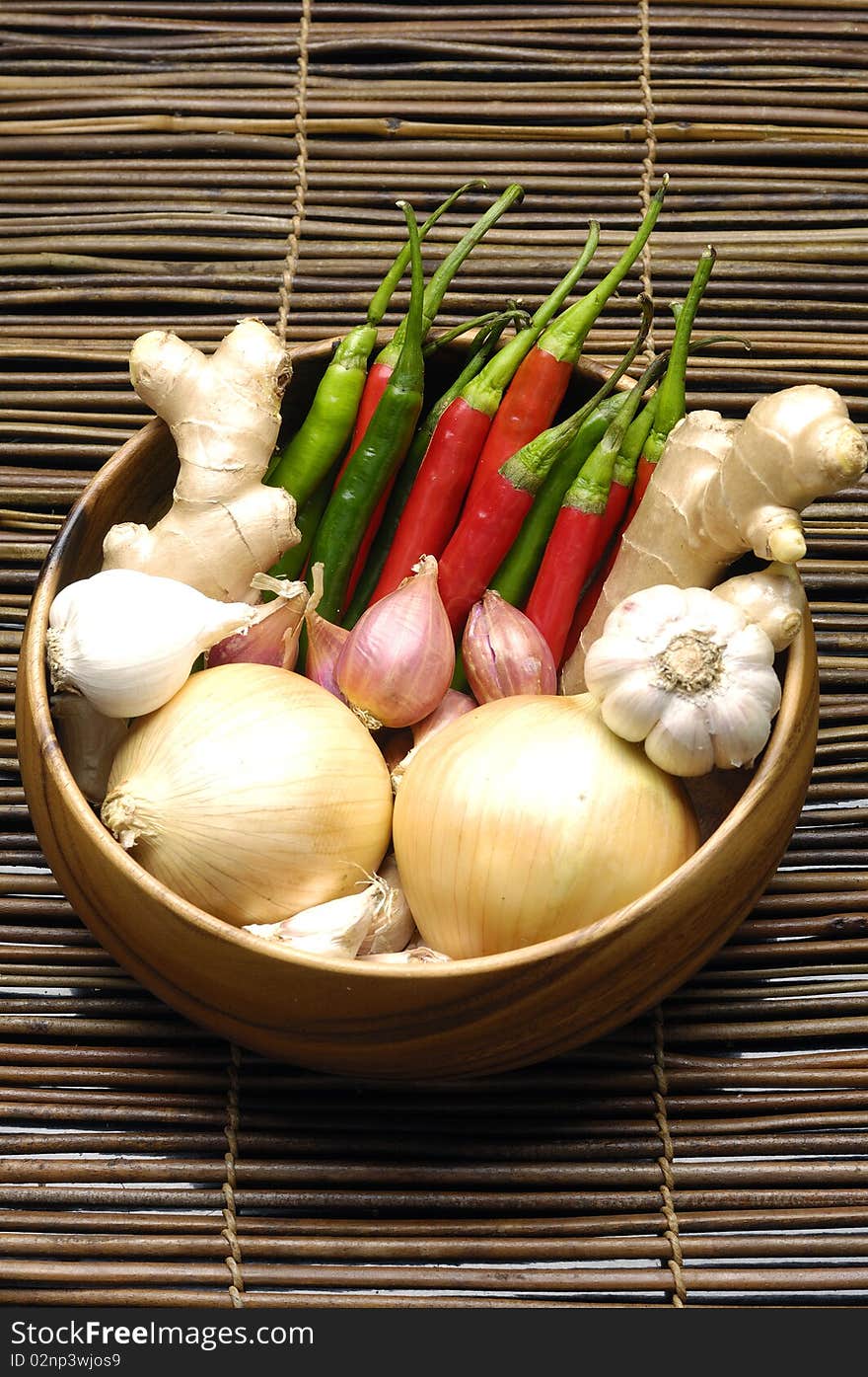 Fresh vegetables on bamboo containers over mat