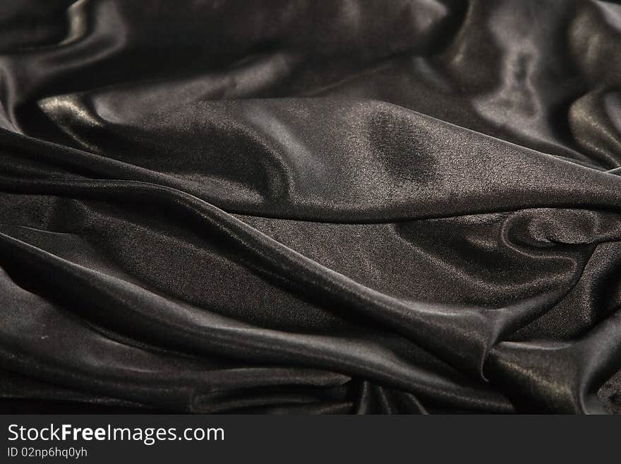 Close-up picture of elegant and soft black fabric fold. Close-up picture of elegant and soft black fabric fold