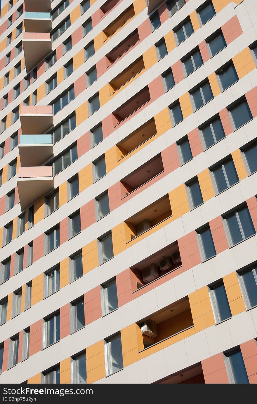 Fragment of modern residential building - windows and balconies in perspective