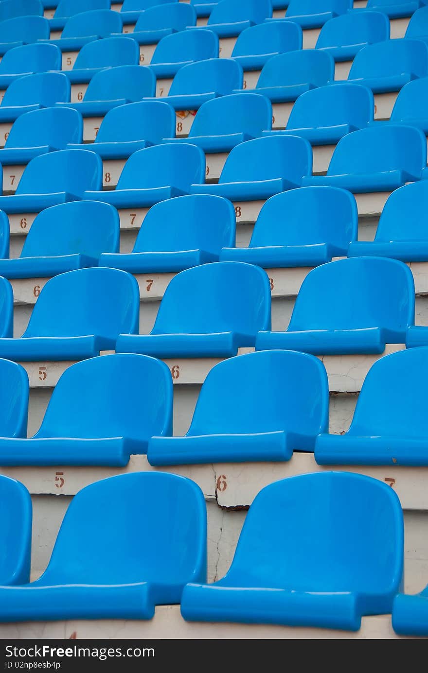 Blue empty stadium seats in a row